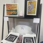 "Je Bulle Librement" art exhibition in Coffs Harboor, stand with Janet Besancon Artist Display of her 2026 Calendars and Prints on sale